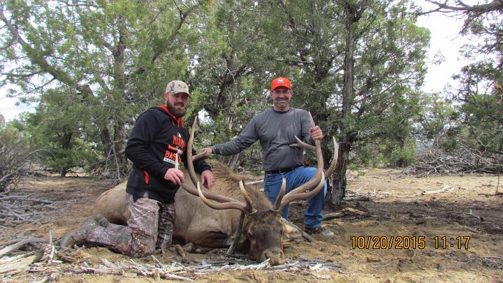 Mike and Greg with Mikes Bull.JPG -                                